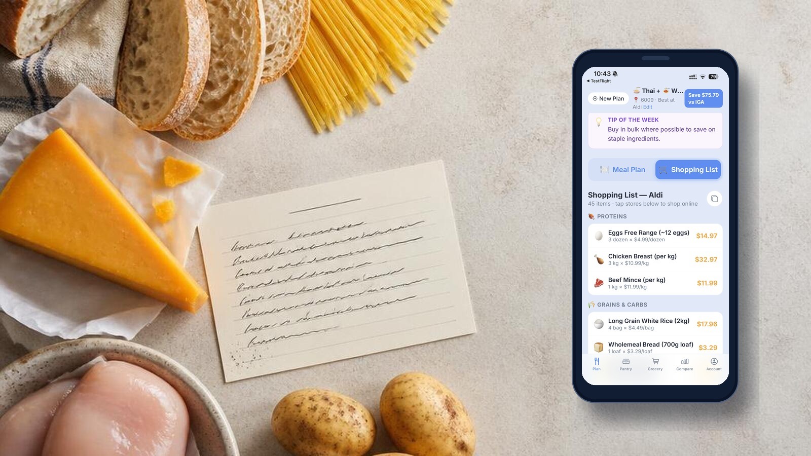 MealPantry shopping list on a phone beside bread, pasta, cheese, chicken and potatoes